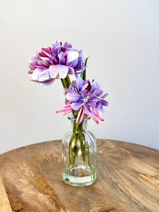Purple Floral Display In Clear Glass Ribbed Jar 21cm