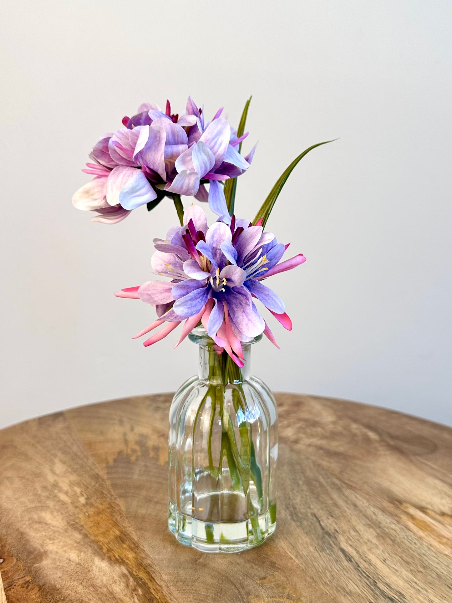 Purple Floral Display In Clear Glass Ribbed Jar 21cm