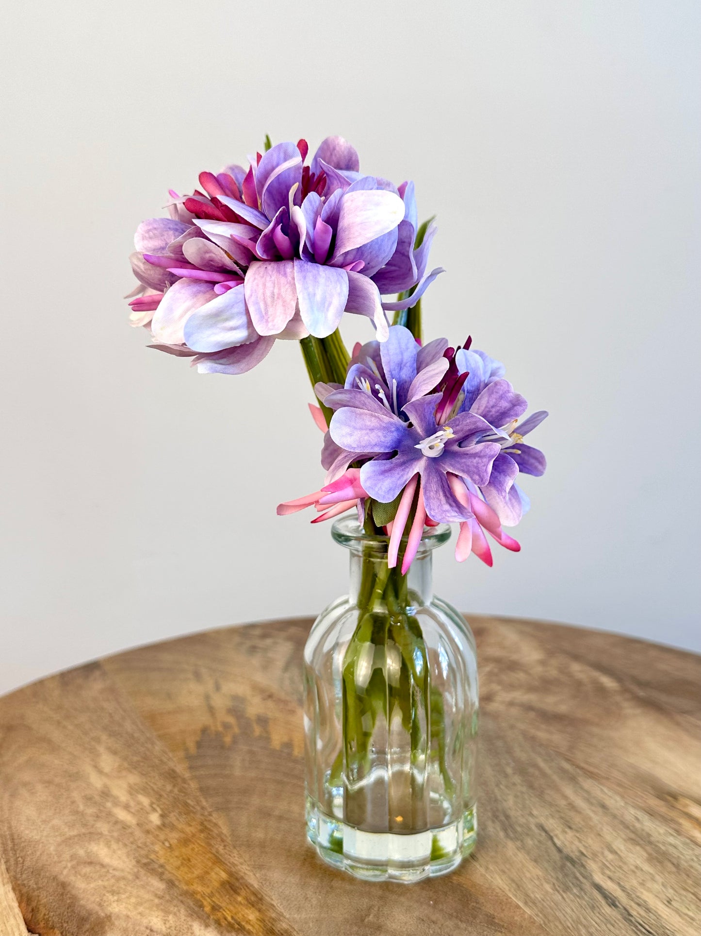 Purple Floral Display In Clear Glass Ribbed Jar 21cm
