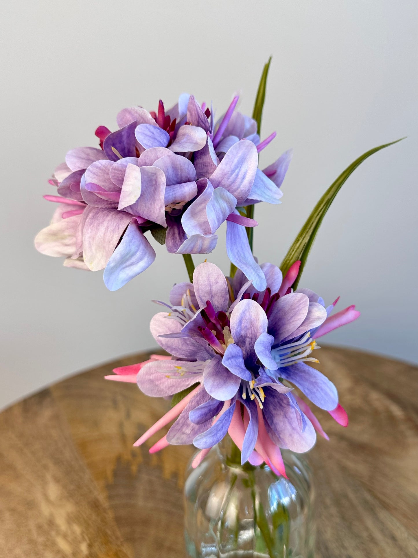 Purple Floral Display In Clear Glass Ribbed Jar 21cm